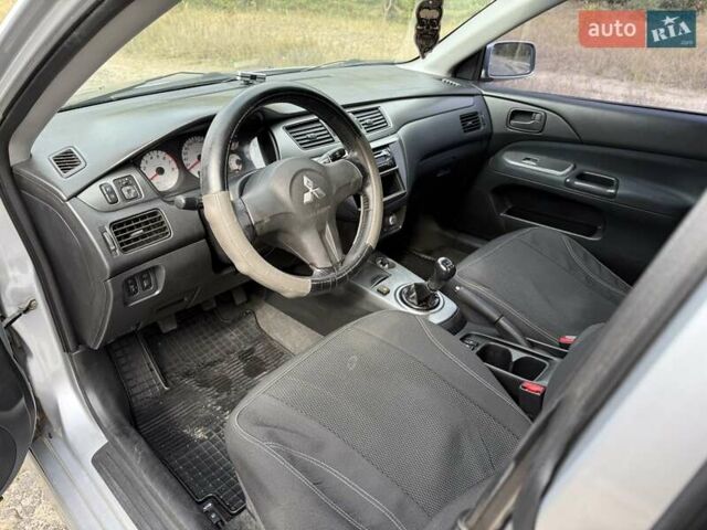 Серый Мицубиси Лансер, объемом двигателя 1.6 л и пробегом 200 тыс. км за 4400 $, фото 16 на Automoto.ua