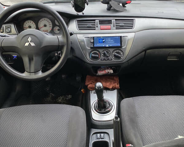 Серый Мицубиси Лансер, объемом двигателя 1.6 л и пробегом 263 тыс. км за 2350 $, фото 8 на Automoto.ua