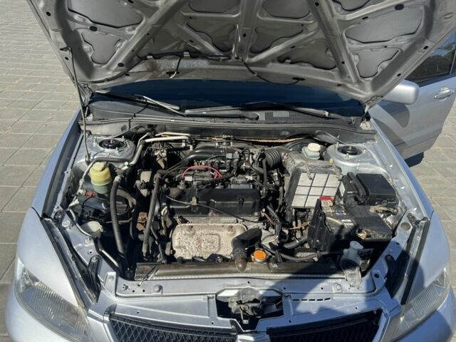 Серый Мицубиси Лансер, объемом двигателя 1.6 л и пробегом 265 тыс. км за 4100 $, фото 7 на Automoto.ua