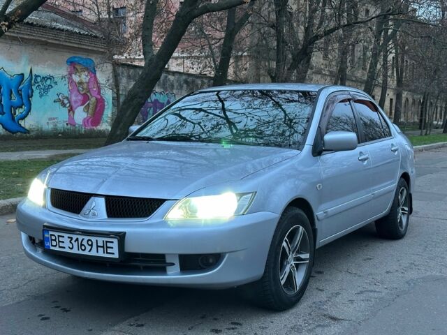 Сірий Міцубісі Lancer, об'ємом двигуна 1.6 л та пробігом 210 тис. км за 4750 $, фото 1 на Automoto.ua