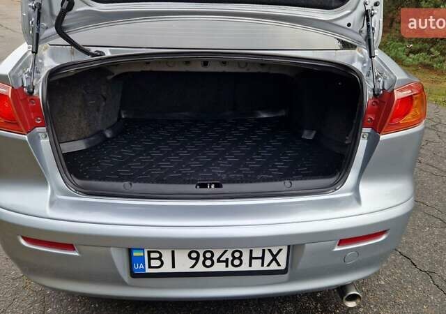 Серый Мицубиси Лансер, объемом двигателя 2 л и пробегом 213 тыс. км за 6550 $, фото 27 на Automoto.ua