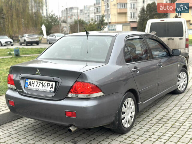 Сірий Міцубісі Lancer, об'ємом двигуна 1.6 л та пробігом 177 тис. км за 2800 $, фото 7 на Automoto.ua