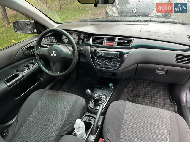 Серый Мицубиси Лансер, объемом двигателя 1.6 л и пробегом 115 тыс. км за 2800 $, фото 10 на Automoto.ua