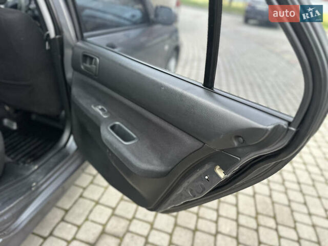 Сірий Міцубісі Lancer, об'ємом двигуна 1.6 л та пробігом 177 тис. км за 2800 $, фото 29 на Automoto.ua