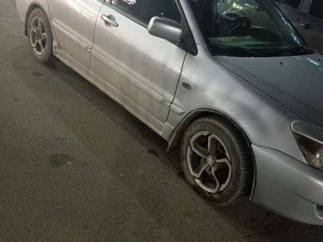 Серый Мицубиси Лансер, объемом двигателя 1.6 л и пробегом 308 тыс. км за 3800 $, фото 3 на Automoto.ua