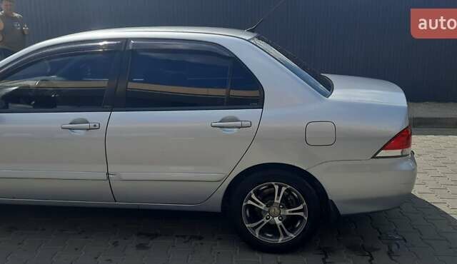 Серый Мицубиси Лансер, объемом двигателя 1.6 л и пробегом 420 тыс. км за 4900 $, фото 1 на Automoto.ua