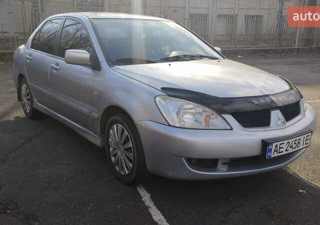 Серый Мицубиси Лансер, объемом двигателя 1.6 л и пробегом 205 тыс. км за 4500 $, фото 1 на Automoto.ua