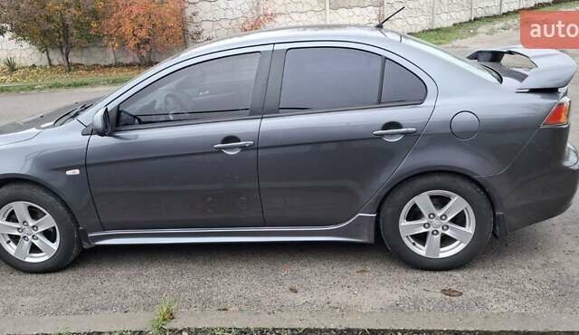 Серый Мицубиси Лансер, объемом двигателя 2 л и пробегом 189 тыс. км за 6800 $, фото 3 на Automoto.ua