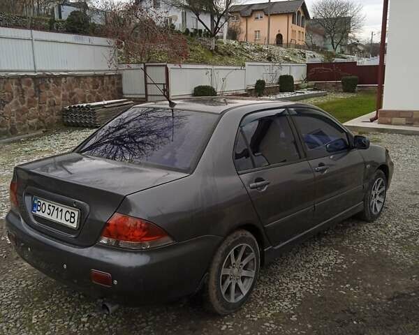 Сірий Міцубісі Lancer, об'ємом двигуна 1.6 л та пробігом 337 тис. км за 4600 $, фото 11 на Automoto.ua