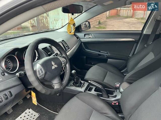Серый Мицубиси Лансер, объемом двигателя 2 л и пробегом 180 тыс. км за 6799 $, фото 12 на Automoto.ua