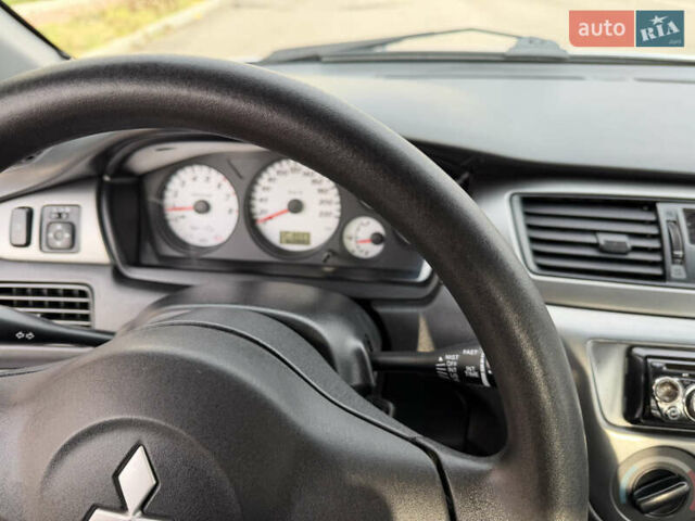 Серый Мицубиси Лансер, объемом двигателя 1.3 л и пробегом 160 тыс. км за 5555 $, фото 44 на Automoto.ua