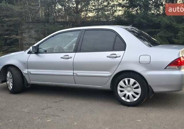 Сірий Міцубісі Lancer, об'ємом двигуна 1.6 л та пробігом 213 тис. км за 3600 $, фото 13 на Automoto.ua
