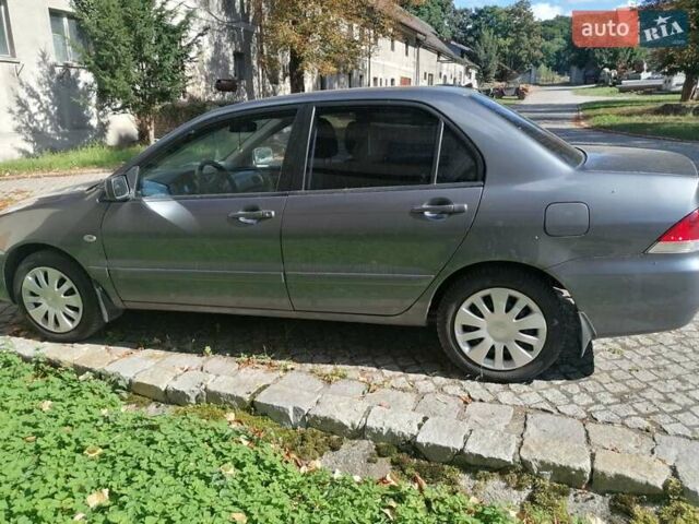 Сірий Міцубісі Lancer, об'ємом двигуна 1.6 л та пробігом 205 тис. км за 3800 $, фото 3 на Automoto.ua
