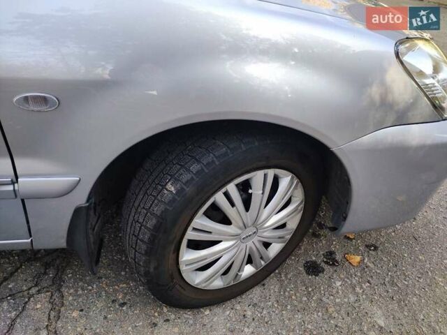 Сірий Міцубісі Lancer, об'ємом двигуна 1.58 л та пробігом 122 тис. км за 6300 $, фото 17 на Automoto.ua