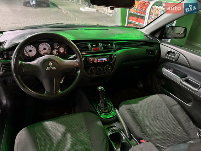 Серый Мицубиси Лансер, объемом двигателя 1.6 л и пробегом 112 тыс. км за 2800 $, фото 16 на Automoto.ua