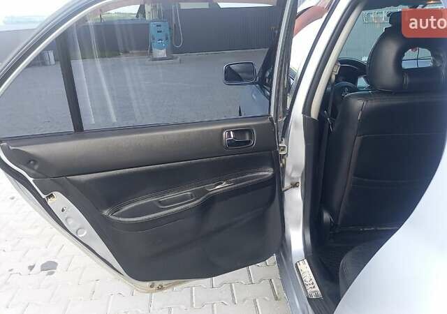 Сірий Міцубісі Lancer, об'ємом двигуна 1.6 л та пробігом 298 тис. км за 4100 $, фото 42 на Automoto.ua