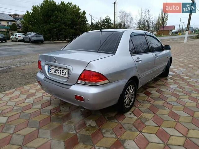 Серый Мицубиси Лансер, объемом двигателя 1.6 л и пробегом 268 тыс. км за 2900 $, фото 2 на Automoto.ua