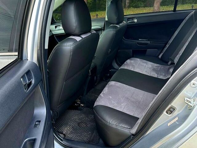 Серый Мицубиси Лансер, объемом двигателя 2 л и пробегом 250 тыс. км за 6000 $, фото 3 на Automoto.ua