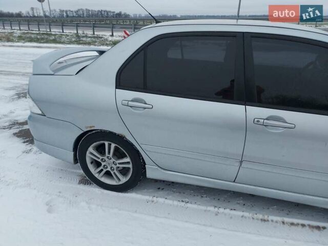 Серый Мицубиси Лансер, объемом двигателя 2 л и пробегом 253 тыс. км за 4200 $, фото 6 на Automoto.ua