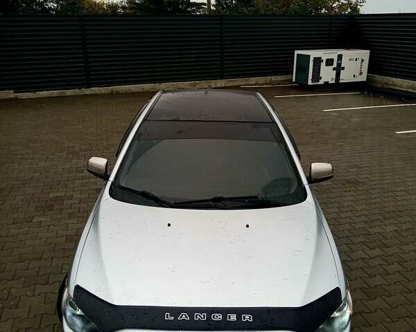 Сірий Міцубісі Lancer, об'ємом двигуна 2 л та пробігом 268 тис. км за 5555 $, фото 13 на Automoto.ua
