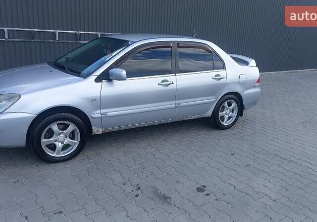 Сірий Міцубісі Lancer, об'ємом двигуна 1.6 л та пробігом 298 тис. км за 4100 $, фото 62 на Automoto.ua