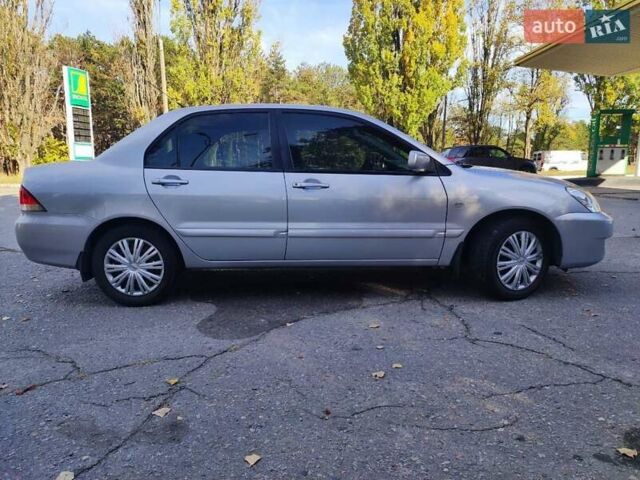 Сірий Міцубісі Lancer, об'ємом двигуна 1.58 л та пробігом 122 тис. км за 6300 $, фото 7 на Automoto.ua