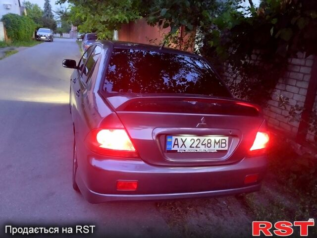 Сірий Міцубісі Lancer, об'ємом двигуна 2 л та пробігом 280 тис. км за 7000 $, фото 9 на Automoto.ua