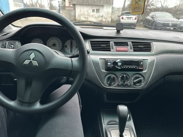 Серый Мицубиси Лансер, объемом двигателя 1.6 л и пробегом 298 тыс. км за 3600 $, фото 7 на Automoto.ua