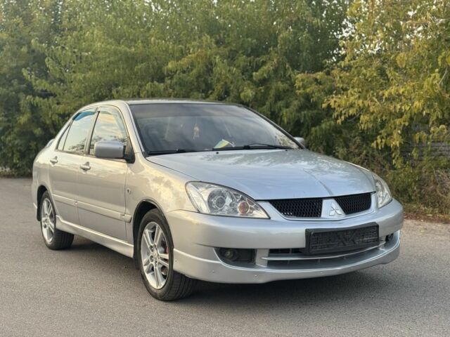 Серый Мицубиси Лансер, объемом двигателя 2 л и пробегом 185 тыс. км за 4600 $, фото 1 на Automoto.ua