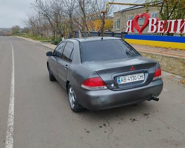 Серый Мицубиси Лансер, объемом двигателя 1.6 л и пробегом 250 тыс. км за 3800 $, фото 3 на Automoto.ua