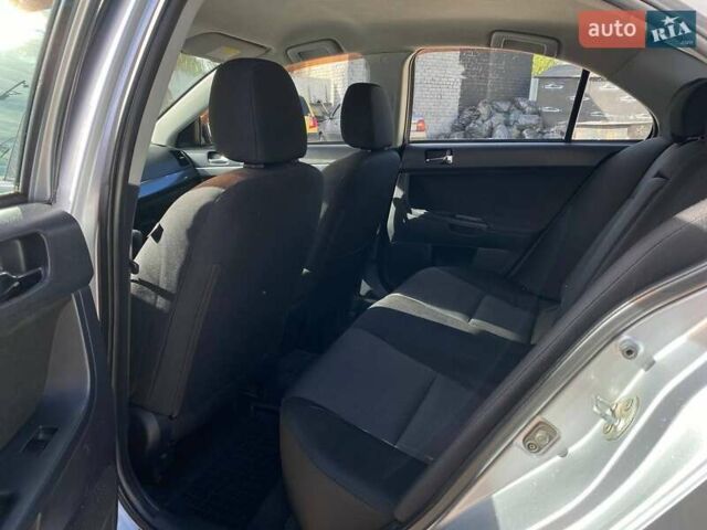 Серый Мицубиси Лансер, объемом двигателя 2 л и пробегом 150 тыс. км за 6100 $, фото 12 на Automoto.ua