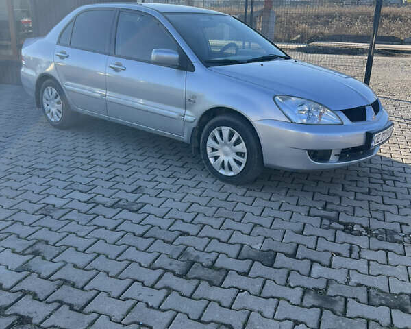 Серый Мицубиси Лансер, объемом двигателя 1.58 л и пробегом 178 тыс. км за 3300 $, фото 5 на Automoto.ua