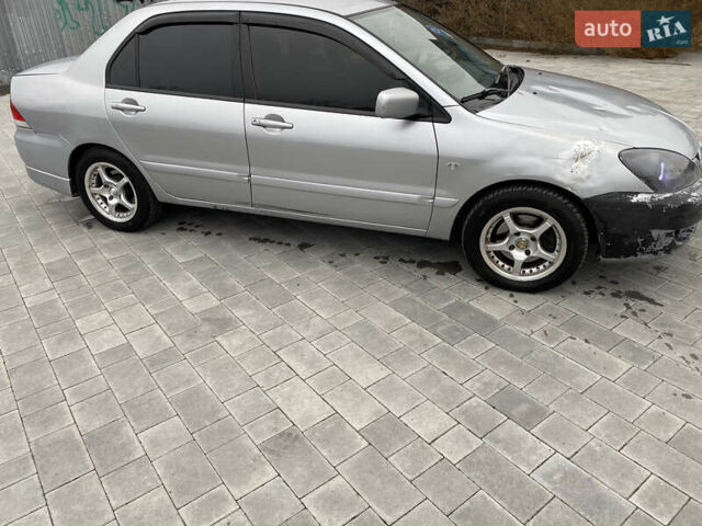 Серый Мицубиси Лансер, объемом двигателя 1.6 л и пробегом 263 тыс. км за 2350 $, фото 5 на Automoto.ua