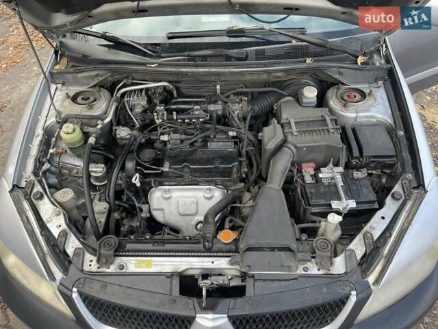Сірий Міцубісі Lancer, об'ємом двигуна 1.58 л та пробігом 305 тис. км за 3300 $, фото 6 на Automoto.ua
