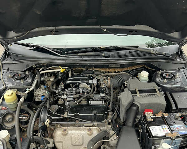 Сірий Міцубісі Lancer, об'ємом двигуна 1.58 л та пробігом 176 тис. км за 4700 $, фото 16 на Automoto.ua