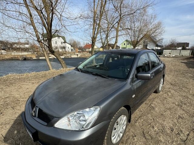 Серый Мицубиси Лансер, объемом двигателя 1.6 л и пробегом 129 тыс. км за 5000 $, фото 6 на Automoto.ua