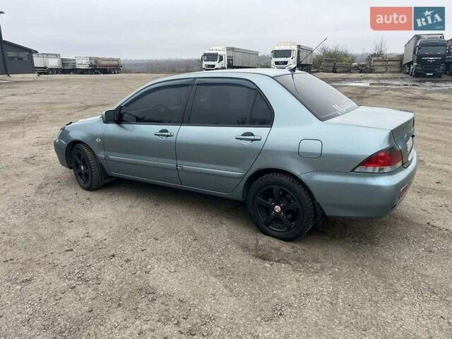 Сірий Міцубісі Lancer, об'ємом двигуна 1.58 л та пробігом 341 тис. км за 4500 $, фото 8 на Automoto.ua