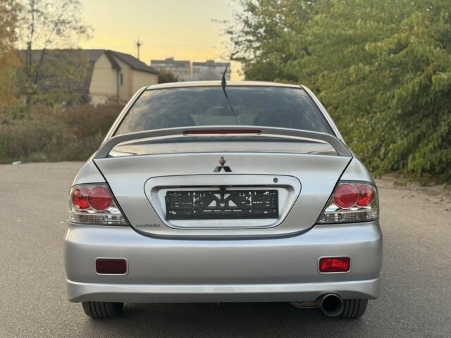 Серый Мицубиси Лансер, объемом двигателя 2 л и пробегом 185 тыс. км за 4600 $, фото 5 на Automoto.ua