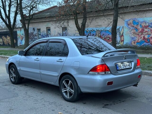 Сірий Міцубісі Lancer, об'ємом двигуна 1.6 л та пробігом 210 тис. км за 4750 $, фото 2 на Automoto.ua