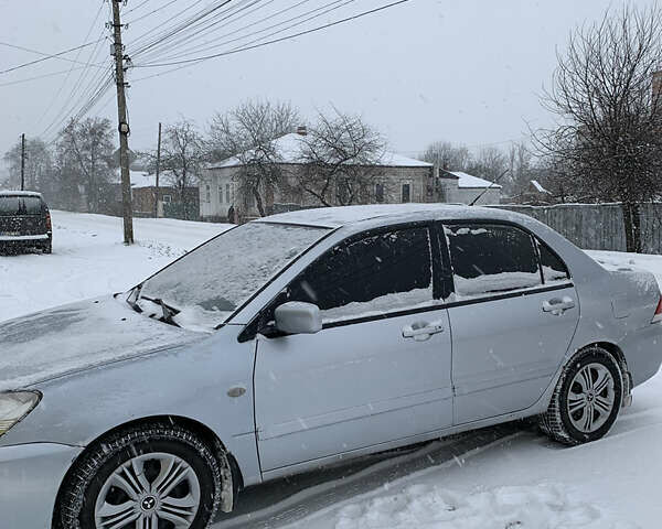 Серый Мицубиси Лансер, объемом двигателя 1.6 л и пробегом 248 тыс. км за 3000 $, фото 4 на Automoto.ua