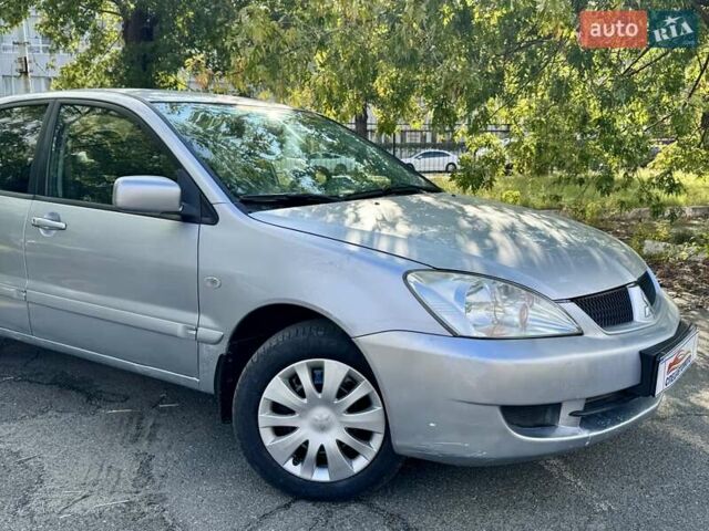 Сірий Міцубісі Lancer, об'ємом двигуна 1.58 л та пробігом 138 тис. км за 4990 $, фото 1 на Automoto.ua