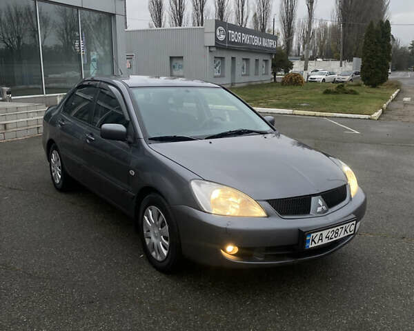 Серый Мицубиси Лансер, объемом двигателя 1.6 л и пробегом 346 тыс. км за 4299 $, фото 3 на Automoto.ua