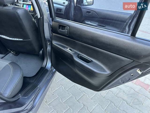 Сірий Міцубісі Lancer, об'ємом двигуна 1.6 л та пробігом 189 тис. км за 6200 $, фото 11 на Automoto.ua