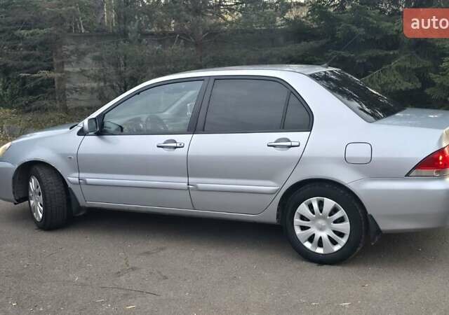 Сірий Міцубісі Lancer, об'ємом двигуна 1.6 л та пробігом 213 тис. км за 3600 $, фото 4 на Automoto.ua