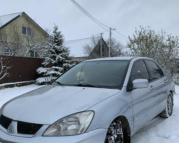 Серый Мицубиси Лансер, объемом двигателя 1.6 л и пробегом 248 тыс. км за 3000 $, фото 1 на Automoto.ua