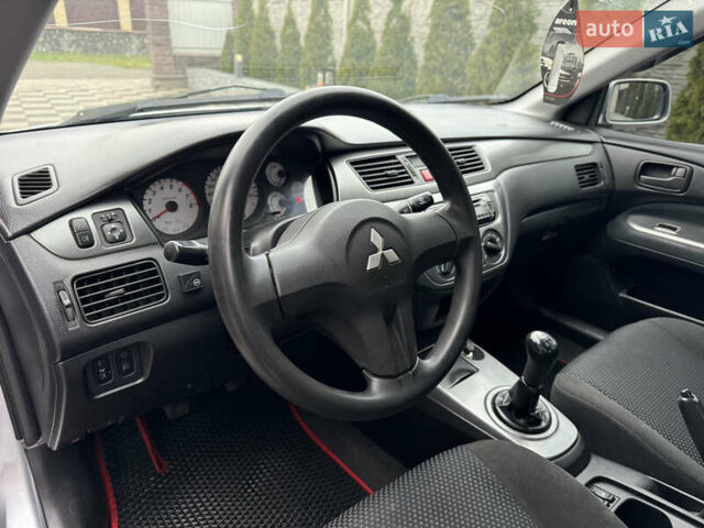 Сірий Міцубісі Lancer, об'ємом двигуна 1.6 л та пробігом 281 тис. км за 3999 $, фото 17 на Automoto.ua
