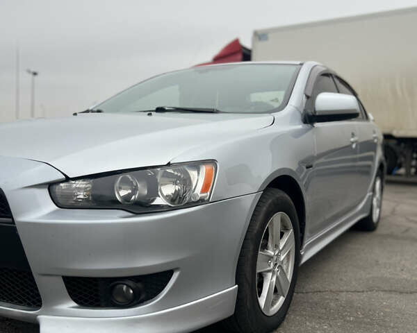 Серый Мицубиси Лансер, объемом двигателя 2 л и пробегом 286 тыс. км за 5800 $, фото 2 на Automoto.ua