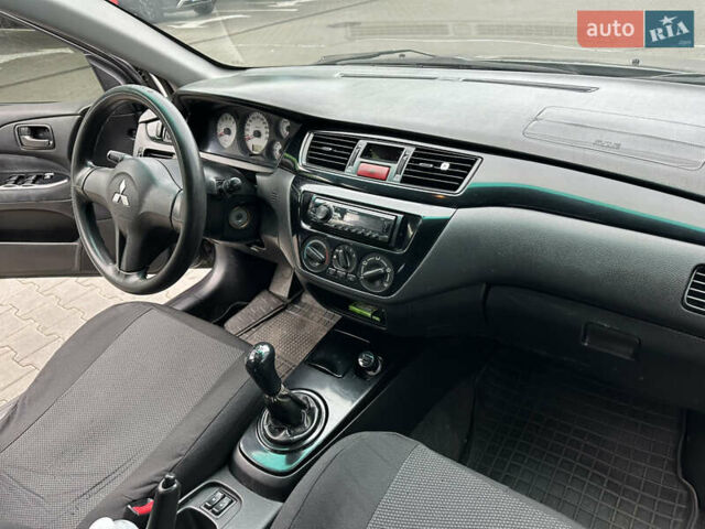 Сірий Міцубісі Lancer, об'ємом двигуна 1.6 л та пробігом 115 тис. км за 2800 $, фото 16 на Automoto.ua