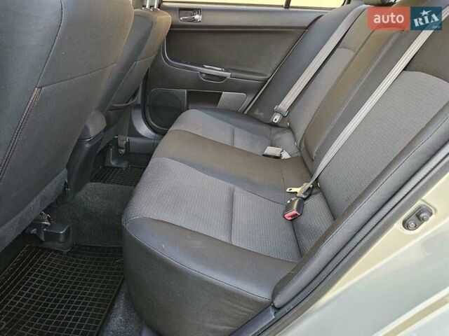 Серый Мицубиси Лансер, объемом двигателя 2 л и пробегом 282 тыс. км за 5450 $, фото 68 на Automoto.ua