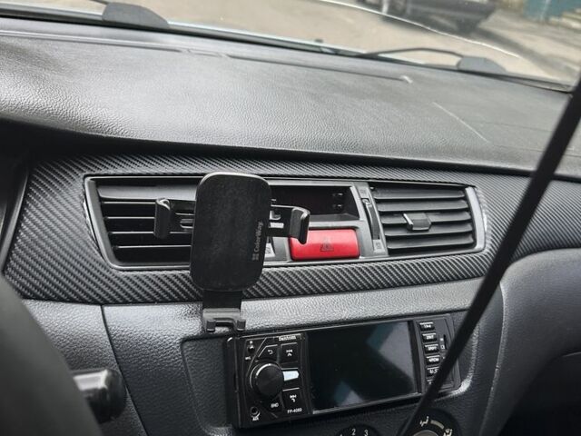 Серый Мицубиси Лансер, объемом двигателя 1.6 л и пробегом 238 тыс. км за 4300 $, фото 9 на Automoto.ua